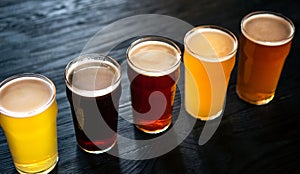 Different types of beers. Ale, dark, light and unfiltered beer and lager, in glasses