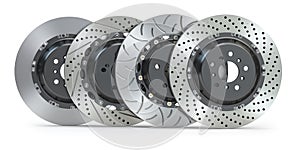 Different types of brake disks. Drilled and slotted brake disks in a row