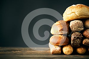 Different types of bread loaves close up with copy space.
