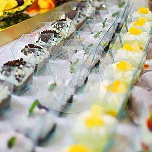 Different types of buffet dessert placed on table. Delicious restaurant raut concept.