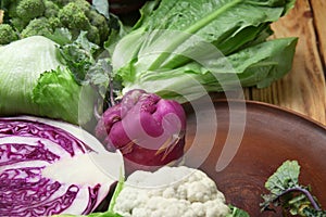 Different types of cabbage on table