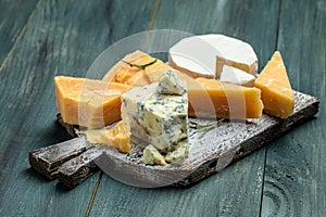 Different types of cheese. Cheeses mix set dor blu chedar camamber brie. place for text, top view