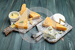 Different types of cheese. Cheeses mix set dor blu chedar camamber brie. place for text, top view
