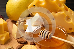 Different types of cheeses on a blackboard