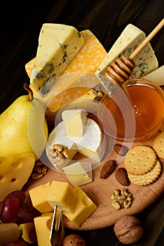 Different types of cheeses on a blackboard