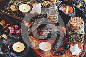 Different types of crystals on wiccan witch altar photo