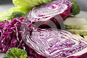 Different types of cut cabbage on table, closeup