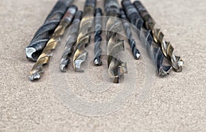 Different Types of Drill Bits. Old and worn-out drill bits in various sizes