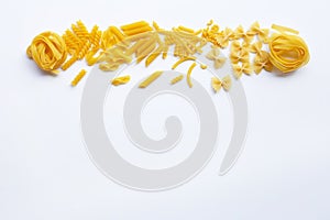 Different types of dry pasta on white