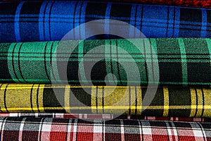 Different types of fabrics lie on each other