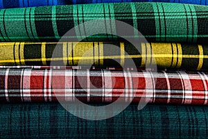 Different types of fabrics lie on each other