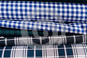 Different types of fabrics lie on each other