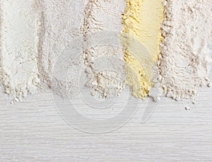 Different types of flour on wooden table