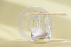 Different types of gelatin powder and sheets on white table