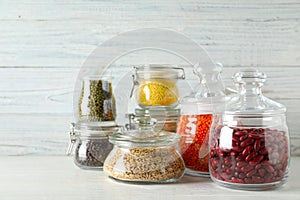 Different types of legumes and cereals on table. Organic grains