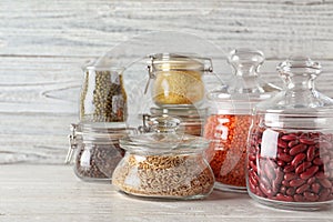 Different types of legumes and cereals on table. Organic grains