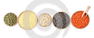 Different types of legumes and cereals on white background, top view. Organic grains