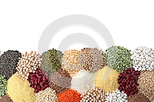 Different types of legumes and cereals on white, top view. Organic grains