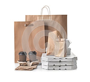 Different types of packages on white background. Food delivery service