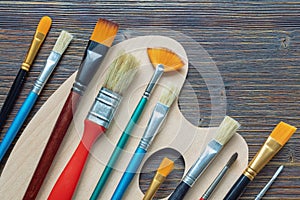 Different types of paintbrushes. Copy space