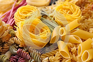 Different types of pasta as background