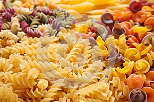 Different types of pasta as background, closeup