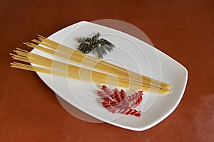 Different types of pasta on white plate