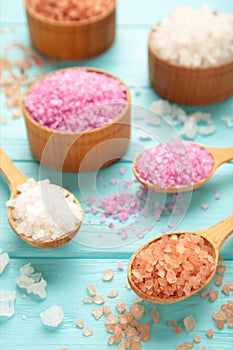 Different types of salt on blue background