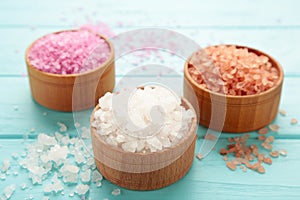 Different types of salt on blue background