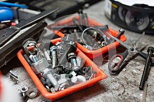 Different types of screws in a plastic box