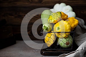 different types of squash in a wicker basket