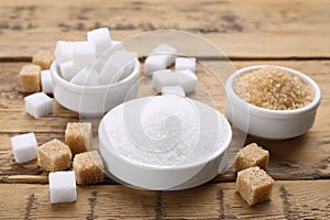 Different types of sugar on wooden table