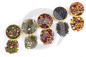 different types of tea on a white background. a kind of delicious tea, fruit tea. top view. place for text