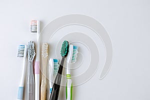 Different types of toothbrushes on a white background.