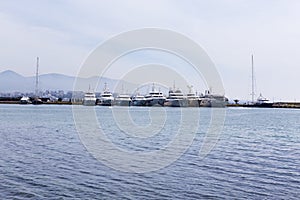 Different types of yachts anchored in Piraeus dock