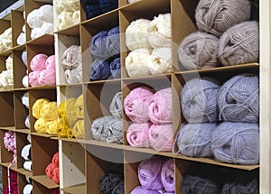 Different types of yarn on the shelves in the store