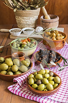 Different varieties and dressings of olives