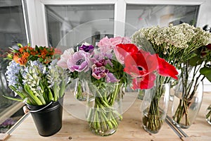 Different varieties. Fresh spring flowers in refrigerator for flowers in flower shop. Bouquets on shelf, florist