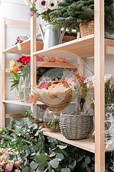 Different varieties. Fresh spring flowers in refrigerator for flowers in flower shop. Bouquets on shelf, florist