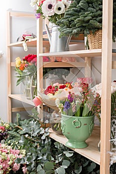 Different varieties. Fresh spring flowers in refrigerator for flowers in flower shop. Bouquets on shelf, florist