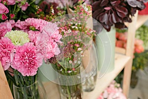 Different varieties. Fresh spring flowers in refrigerator for flowers in flower shop. Bouquets on shelf, florist