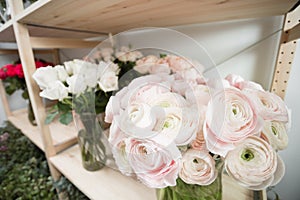 Different varieties. Fresh spring flowers in refrigerator for flowers in flower shop. Bouquets on shelf, florist