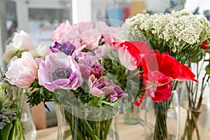 Different varieties. Fresh spring flowers in refrigerator for flowers in flower shop. Bouquets on shelf, florist