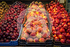 Different varieties of peaches on sale in a local market.