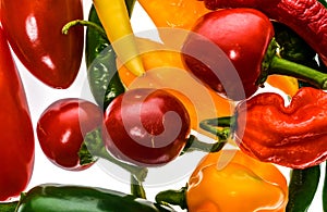 Different variety of hot peppers or chilies, isolated on white.