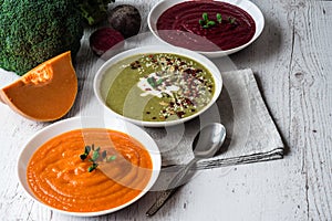 Different vegan food. Colorful vegetables cream soups and ingredients for soup. Healthy eating, dieting, vegetarian