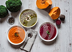 Different vegan food. Colorful vegetables cream soups and ingredients for soup. Healthy eating, dieting, vegetarian