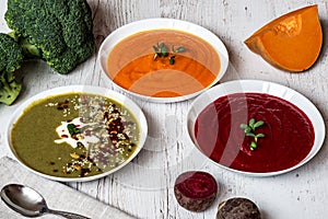 Different vegan food. Colorful vegetables cream soups and ingredients for soup. Healthy eating, dieting, vegetarian