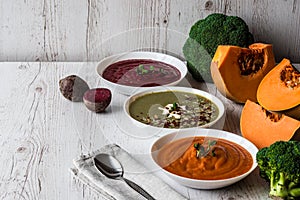 Different vegan food. Colorful vegetables cream soups and ingredients for soup. Healthy eating, dieting, vegetarian