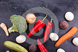 Different vegetables on dark background